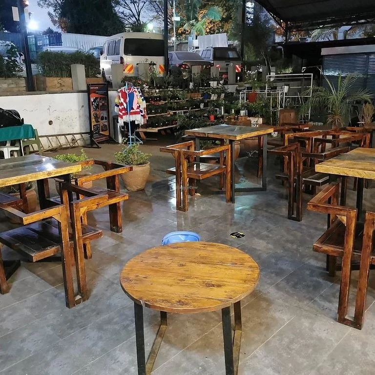 Inside a JooSmoo café, with seating and a display counter